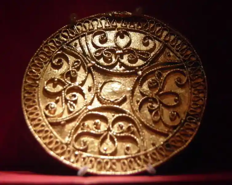 Half circles forming a cross, swirls